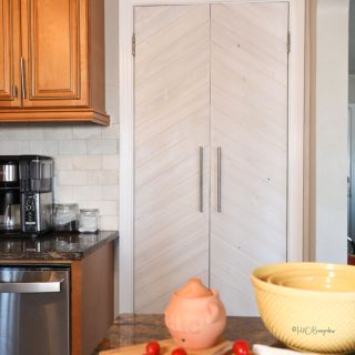 DIY hollow core door makeover for the paintry with wood in a chevron pattern