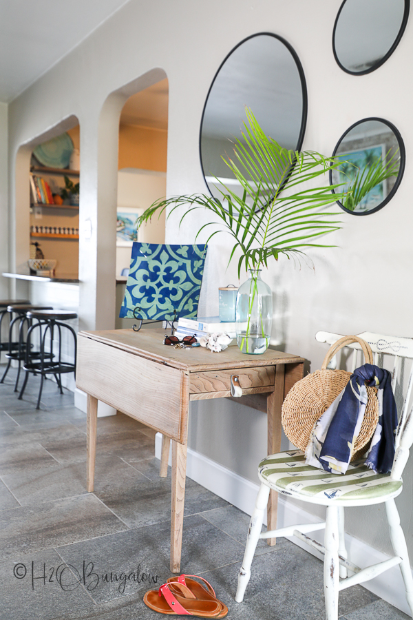 staged bleached wood table with chair 