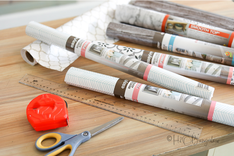 How to decorate the back of a bookcase + easy shelf liners for the