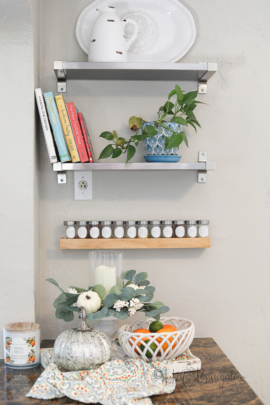 kitchen spice rack on painted island 