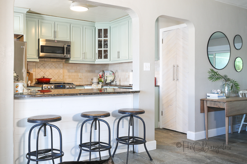 coastal vibe with light blue painted kitchen cabinets 