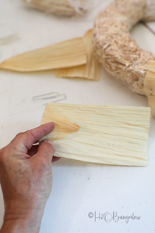 step 1 to make corn husk wreath, fold corn husk