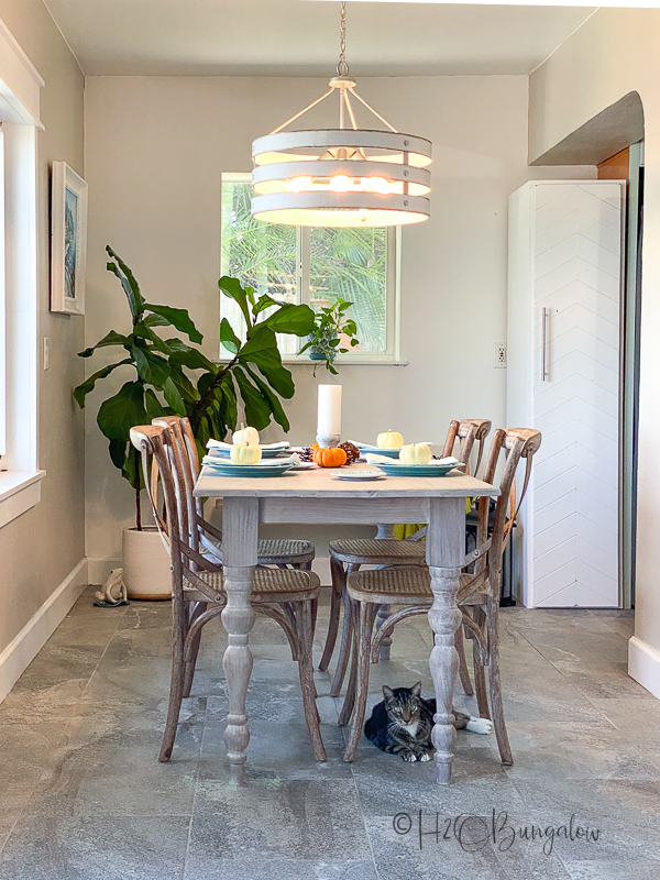 DIY freestanding pantry with moveable shelves and a chevron door 