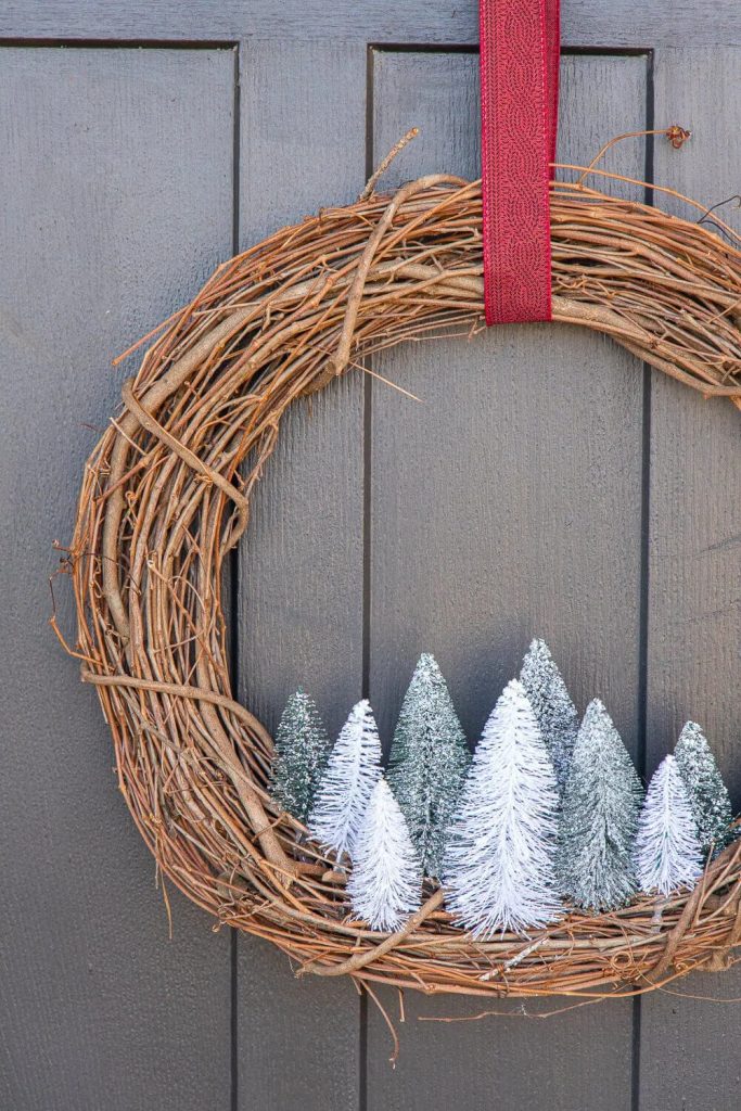 Grapvine wreath with bottle brush trees